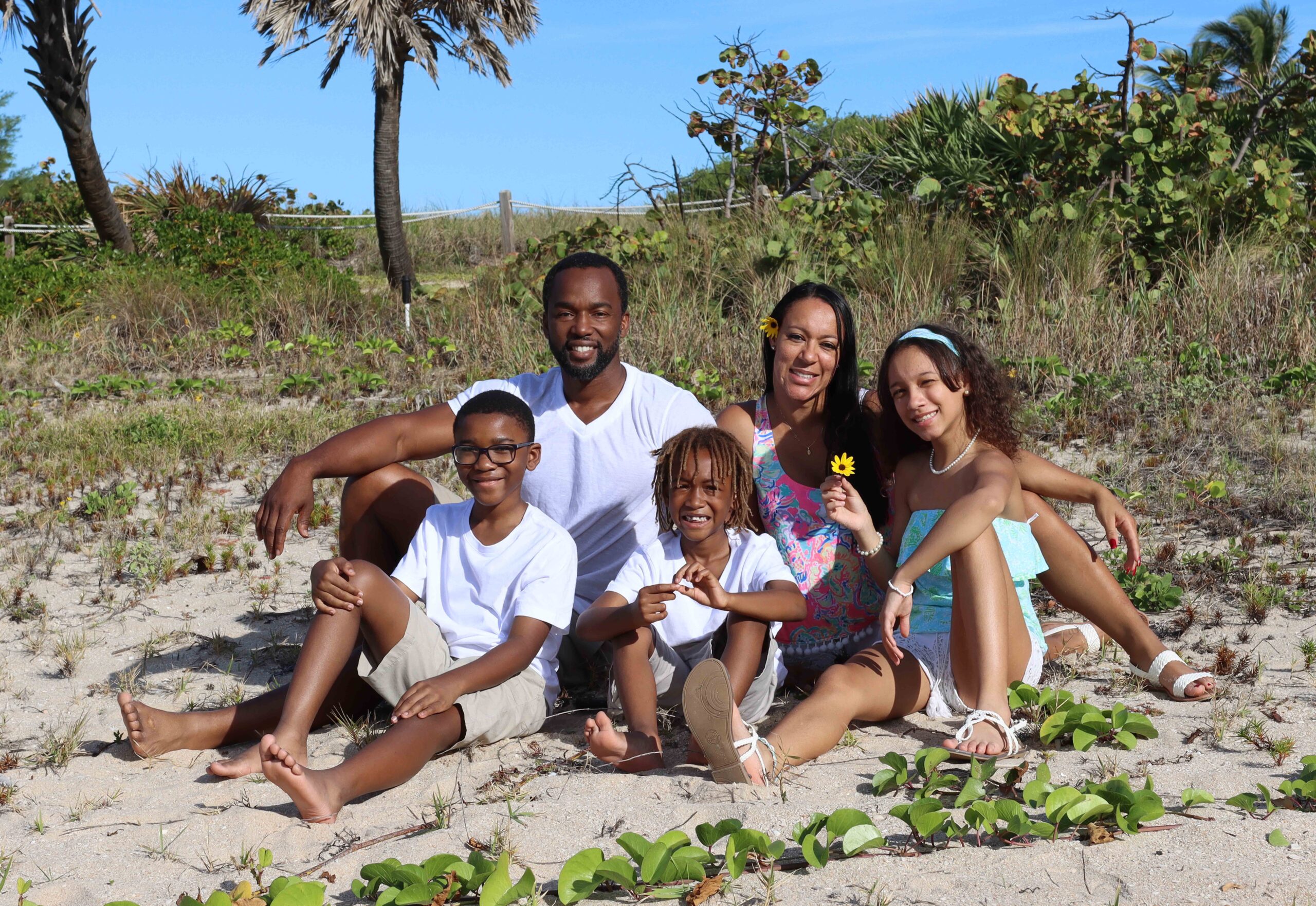 Emmanuel Banks with his wife and three children on the beach in South Florida