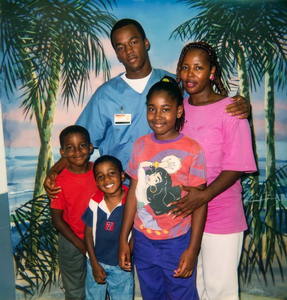Emmanuel Banks in prison blues during a family visit